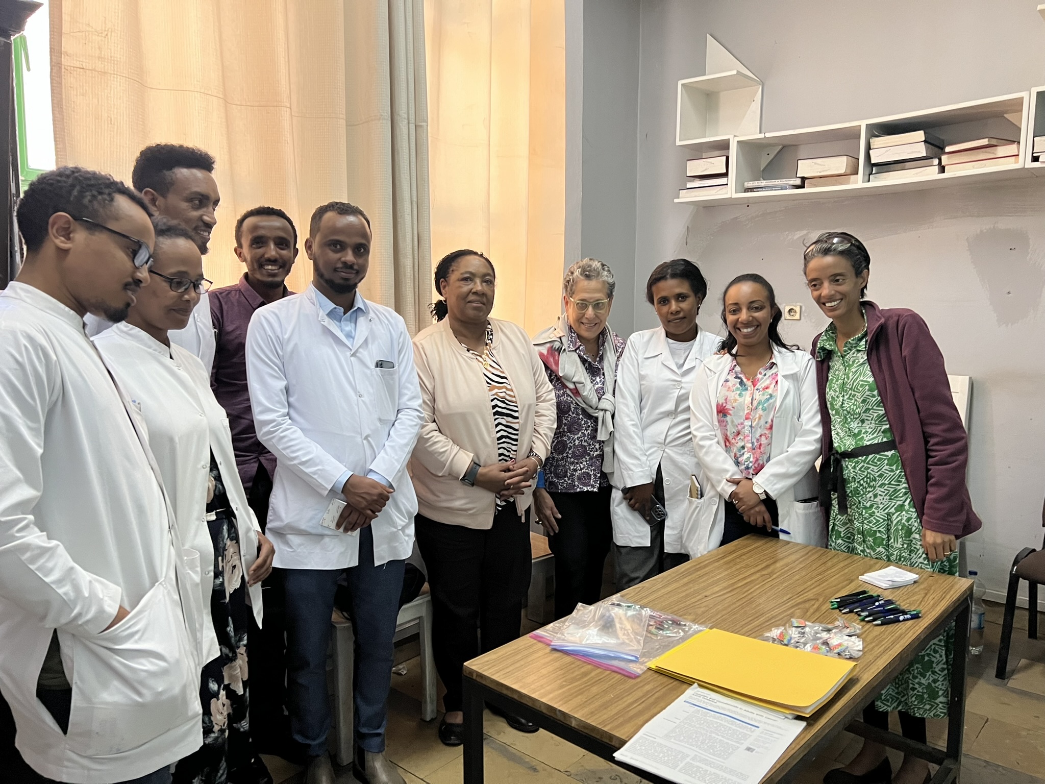 Group of medical professionals posing for a photo at a conference